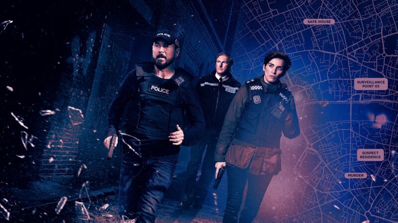 Three AC-12 officers walking down a dark alley